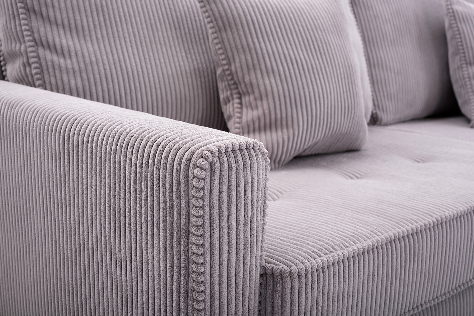 Sofa tapicerowana rozkładana z poduchami Risa z funkcją spania